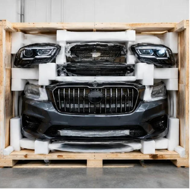 Facelift bumper, grille and headlights secured in a protective export crate — illustrative