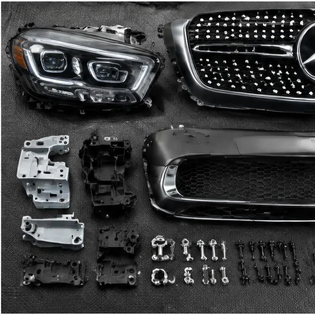 Headlight, grille and bumper mounting brackets arranged with fasteners