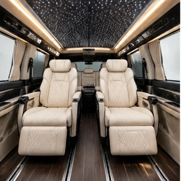 Executive van cabin with cream captain seats and starlight ceiling — illustrative